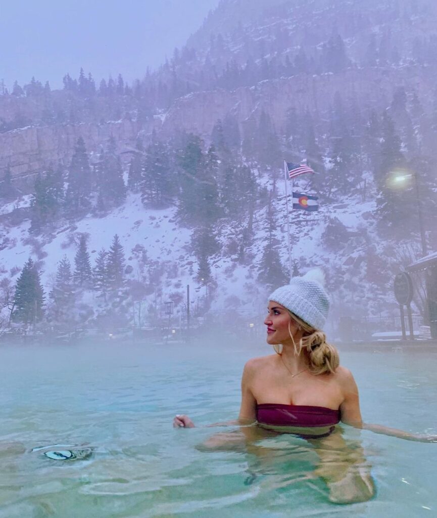 Visitor relaxing in Ouray Natural Hot Springs, known for its mineral-rich waters.