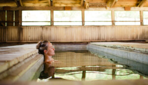Enjoying a tranquil soak at Wilbur Hot Springs surrounded by nature.