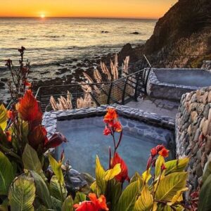 Soaking in the cliffside hot springs at Esalen Institute, overlooking the Pacific Ocean.